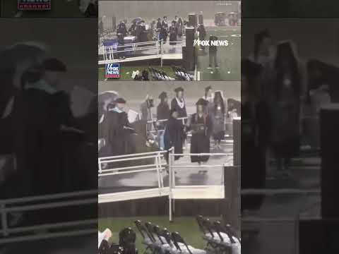 GRADUATION GOES ON: Ceremony continues despite torrential downpour #foxnews #news #shorts