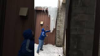 Knocking down massive icicle