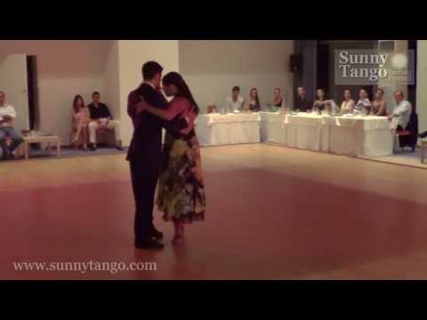  Sebastian Jimenez  and  Maria Ines Bogado  are  dancing  to  the  tango  "  Recuerdo  "  by  Osvaldo Pugliese  at  Sunny Tango Festival  in  2013