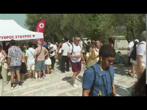 Red Cross workers set up at Acropolis to assist tourists as temperatures swell