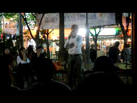 Korean guy singing at the Hongdae Playground in Seoul