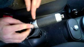 How to remove the handbrake cover on a Mini Cooper