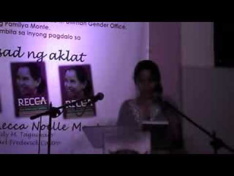 Kerima Tariman reads excerpts from a poem at book launching