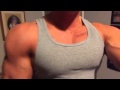 big chest flexing in grey tank top