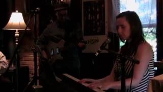 "Call It Democracy" by Bruce Cockburn, performed by Elizabeth Shepherd & Michael Occhipinti