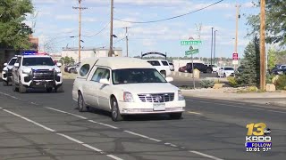 Casket of fallen Ofc. Guerin Sandoval escorted from to Pueblo funeral home