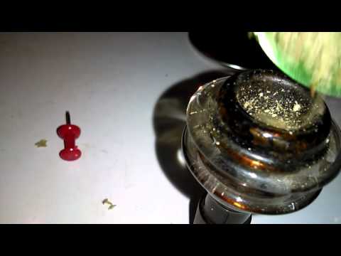 Bob Marley grinder, OG kush and a dab rig