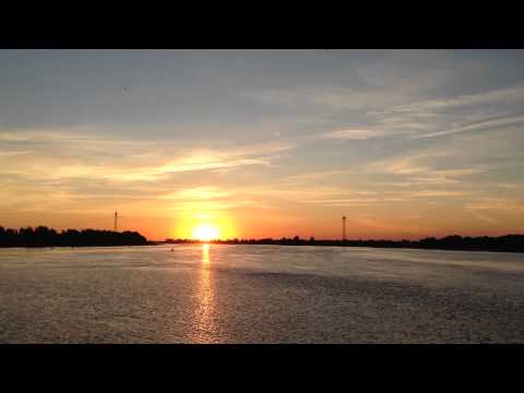 Sunrise over the river. Timelapse