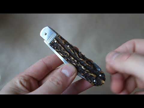 Mikov fixir traditional Czech pocket knife with one blade, can and cork openers and saw blade.