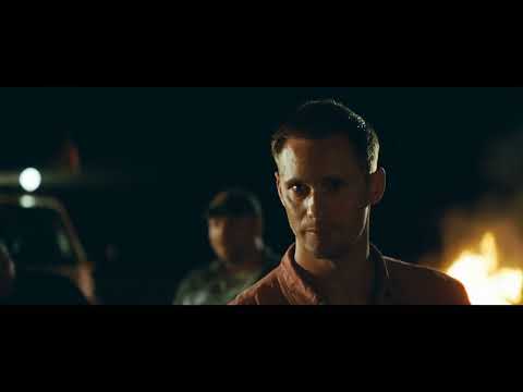 Trailer shot — pickup convoy and bar signs, where Southern rock cues live
