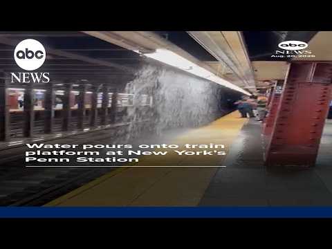 Water pours onto train platform at New York's Penn Station