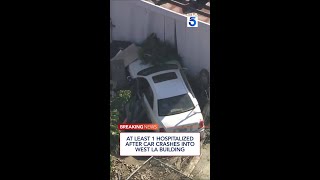 At least 1 hospitalized after car crashes into West LA building