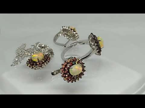 Серебряное кольцо с эфиопским благородным опалом 0.54ct (7х5мм) и сапфирами Сонгеа Размер 16.0 - фото 1 - id-p2917555331