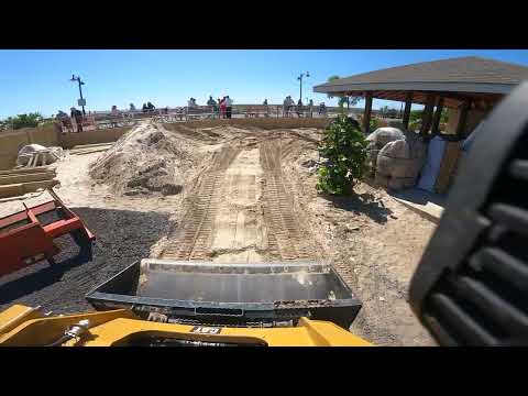 Cat 259D moving sand