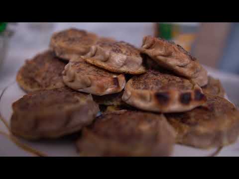 Making traditional Udmurt pies. Russian nations cuisine and village life in Russia