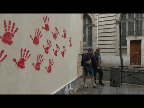 Holocaust memorial and facades in Paris hit with red hand graffiti | AFP
