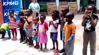 Children from the Sunshine Association sing wheels on the bus
