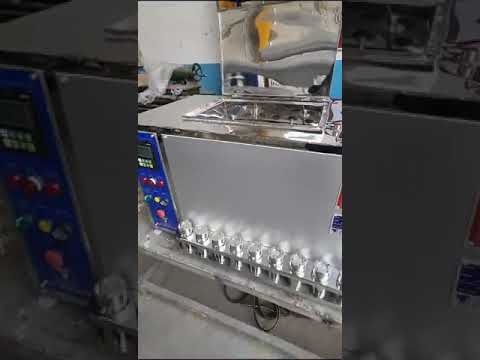 Vertical glycerine beaker bath dyeing machine