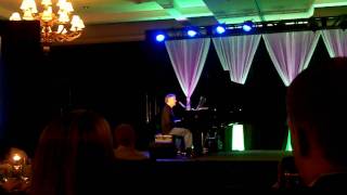 Bruce Hornsby singing "Another Day in Paradise"