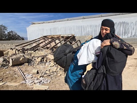 The sad tears of two orphan girls in grandmother's arms: Their home was destroyed