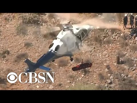Helicopter rescue of injured woman spins out of control in Phoenix