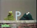 Sesame Street Kermit Shows The Letter B To Cookie Monster