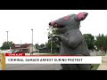 Woman Arrested For Damaging Inflatable Rat Outside Funeral Home