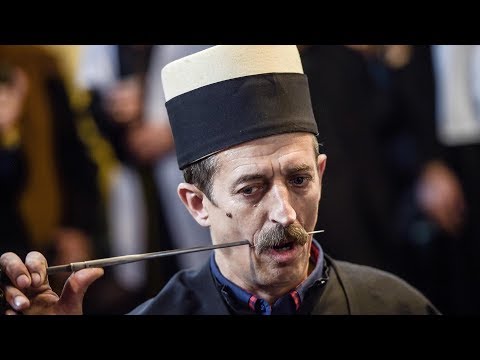 Kosovo Dervishes pierce their mouths in celebration of spring