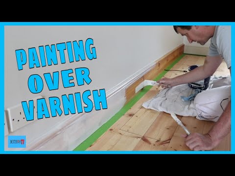 Painting over a varnished skirting board.