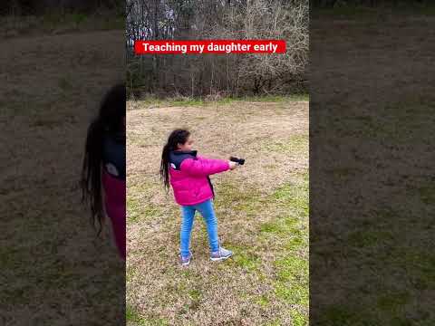 My daughter shooting her first gun. (G2C)