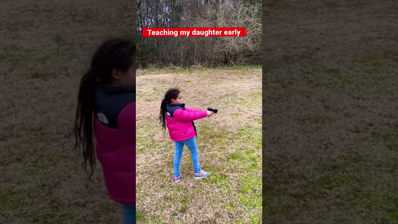 My daughter shooting her first gun. (G2C)