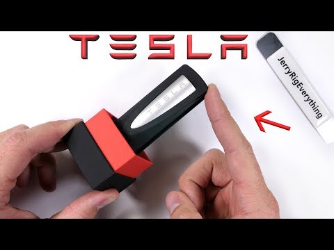 Tesla makes a PHONE CHARGER?! - Teardown