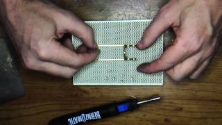 Soldering slot car chassis using a ceramic block