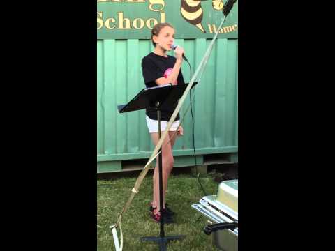 Grace singing at the North Reading Relay for Life, 2015