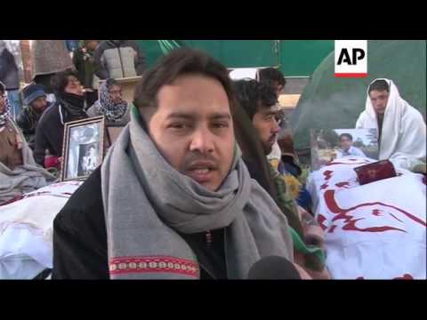 Shiites keep up protest by coffins of victims, demand better security