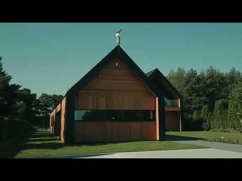 Dom na Kujawach. Nowoczesne stodoły nad malowniczym jeziorem spod kreski Exterio architektura