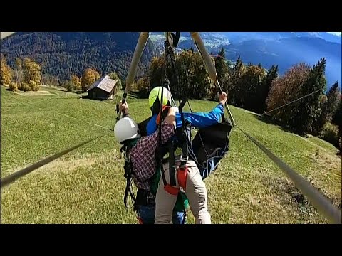 Man hangs on for dear life during harrowing hang-gliding mishap