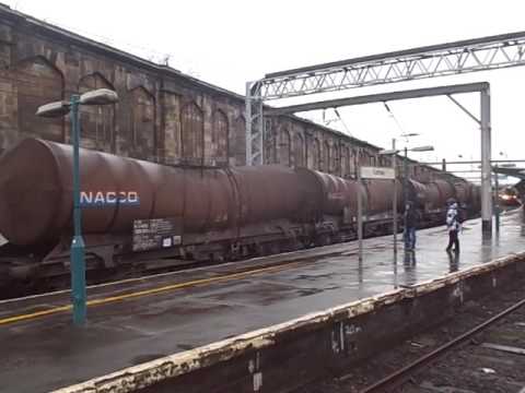 The x2 Class 90 DB Cargo UK Nos.90035+90029 with ICA Bogie Tank Wagons was over halted at Carlisle.