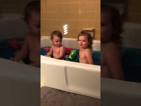 What a Toot! Little Girl Makes Bubbles at Bath Time
