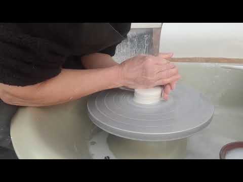 Throwing a small porcelain bottle on the wheel