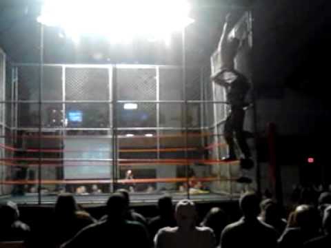 Shiima Xion powerbombs Super Hentai off the cage!