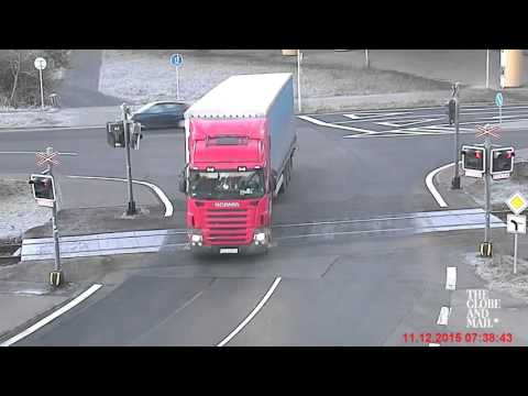 Watch as a passenger train rips a tractor trailer in two in the Czech Republic