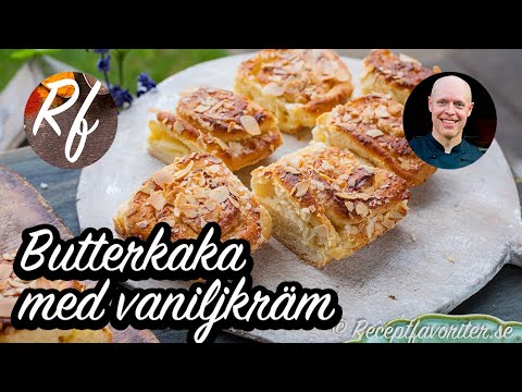 Saftig butterkaka med dubbel vaniljfyllning av vaniljkräm och vaniljsmör toppad med mandelspån. >