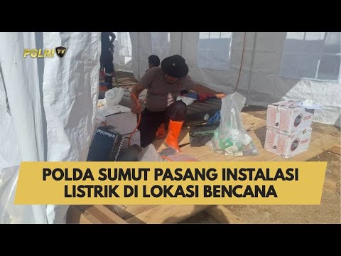 POLDA SUMUT PASANG INSTALASI LISTRIK DI LOKASI BENCANA