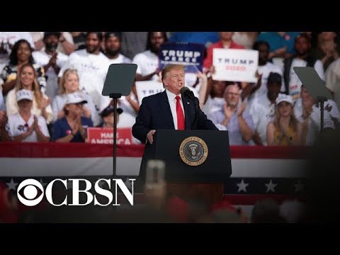 Trump laughs off "shoot them" remark about migrants at Florida rally