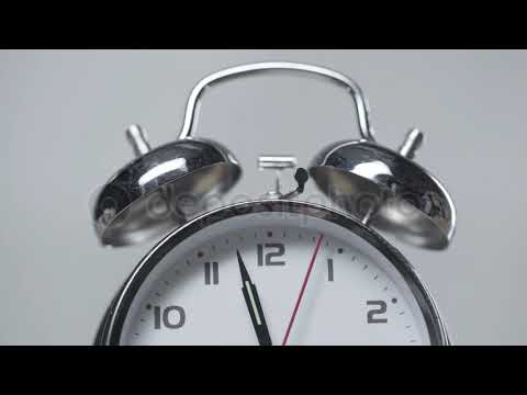 Shiny metal vintage alarm clock isolated on grey — Royalty-free Stock Video