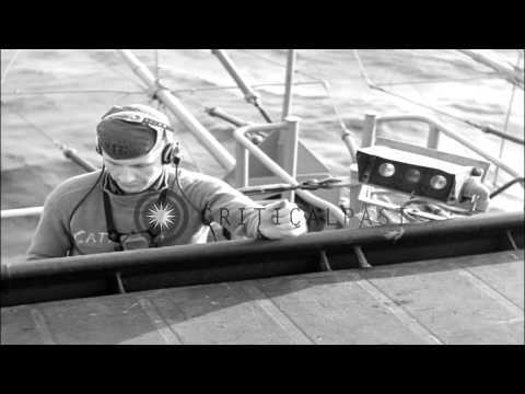 A catapult officer signals the jet aircraft for safe take off on a flight deck in...HD Stock Footage