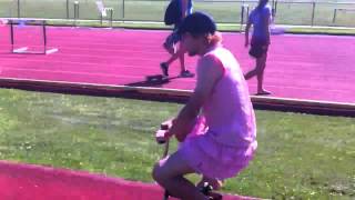 Emiel (Emily) in a dress riding mini bicycle