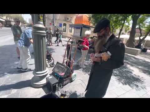 Orthodox Jewish Guy shredding guitar in Jerusalem -August 8 2022