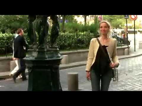 Official theatrical trailer still for Before Sunset showing Jesse and Celine walking in Paris